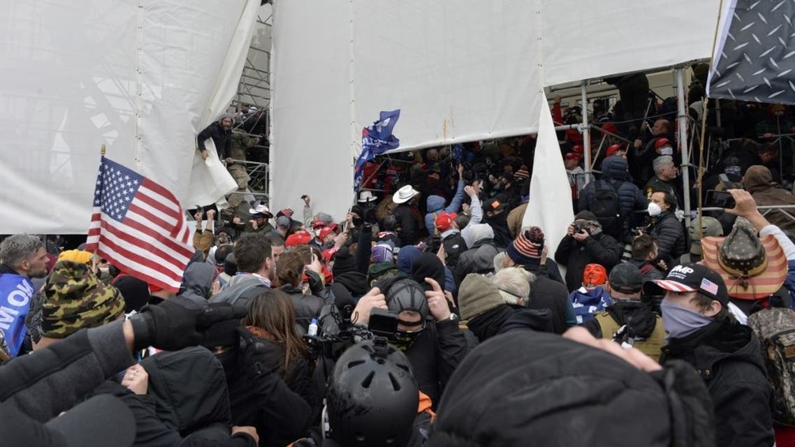 Trump supporters clash with police and security forces as they storm the US Capitol in Washington D.C on January 6, 2021. (AFP)