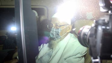 Abu Bakar Bashir, the radical Muslim cleric and alleged mastermind of the 2002 Bali bombings, is seen inside a car as he is released from Gunung Sindur prison in Bogor, West Java province, Indonesia, on January 8, 2021. (Reuters)