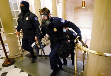 US Capitol police officers take positions as protestors enter the Capitol building during a joint session of Congress to certify the 2020 election results on Capitol Hill in Washington, US, on January 6, 2021. (Reuters)