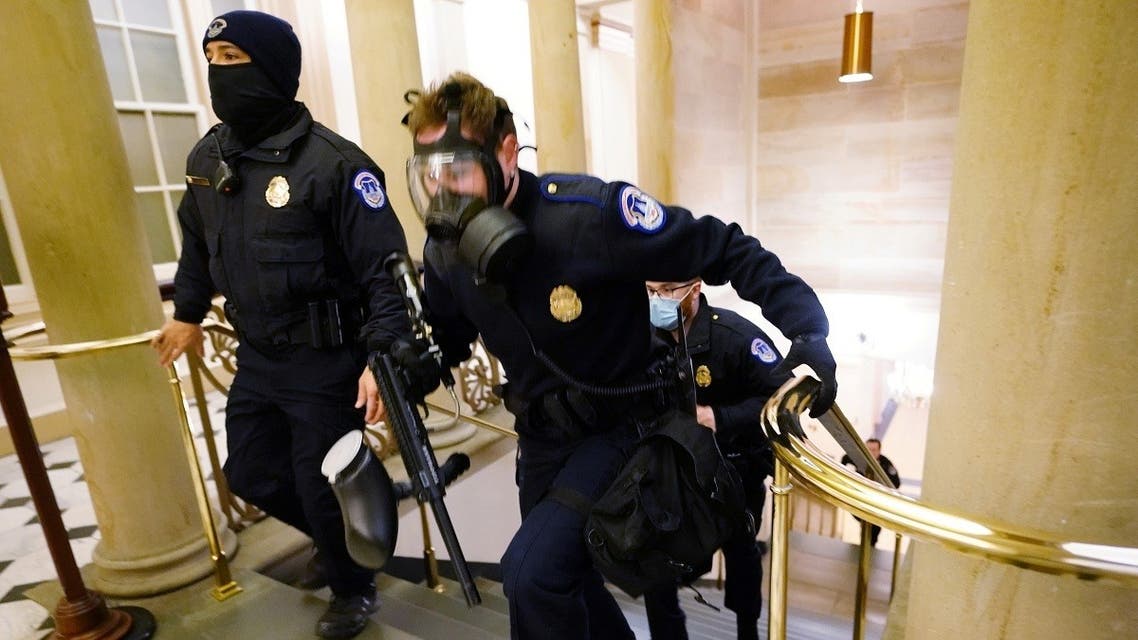 US Capitol police officers take positions as protestors enter the Capitol building during a joint session of Congress to certify the 2020 election results on Capitol Hill in Washington, US, on January 6, 2021. (Reuters)