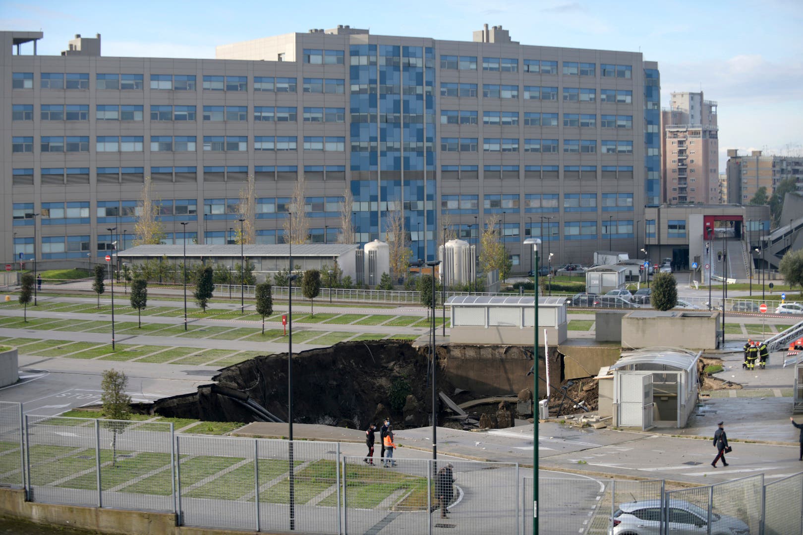 A view of the large sinkhole that opened overnight in the parking of Ospedale del Mare hospital in Naples, Italy, Friday, Jan. 8, 2021. (Alessandro Pone/LaPresse via AP)