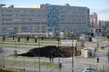  A view of the large sinkhole that opened overnight in the parking of Ospedale del Mare hospital in Naples, Italy, Friday, Jan. 8, 2021. (Alessandro Pone/LaPresse via AP)