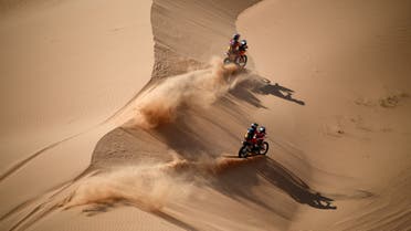 Australian biker Toby Price (top) and Argentinian biker Kevin Benavides compete during Stage 4 of the Dakar Rally 2021 between Wadi Ad-Dawasir and Saudi Arabia's capital Riyadh, on January 6, 2021. FRANCK FIFE / AFP