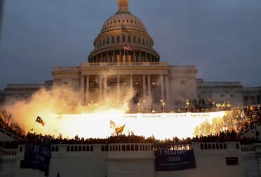 An explosion caused by a police munition is seen while supporters of U.S. President Donald Trump gather in front of the Capitol, Jan. 6, 2021. (Reuters)