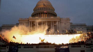 An explosion caused by a police munition is seen while supporters of U.S. President Donald Trump gather in front of the U.S. Capitol Building in Washington, U.S., January 6, 2021. REUTERS