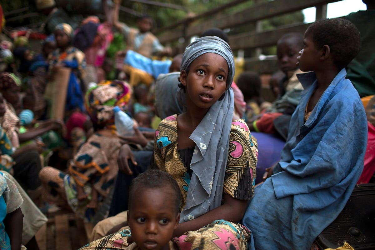 A girl sits at the back of a truck as she prepares to flee sectarian violence with other Muslim families in a convoy escorted by African Union (AU) peacekeepers towards the border with Cameroon, in the town of Bouar, west of the Central African Republic. (File photo: Reuters)