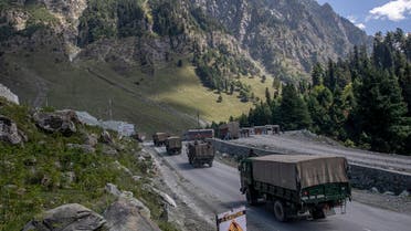 An Indian army convoy moves on the Srinagar- Ladakh highway at Gagangeer, northeast of Srinagar, Indian-controlled Kashmir. (AP)