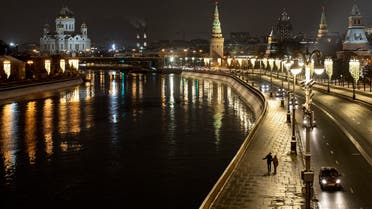 A couple walk an empty embankment of the Moscow River. (AP)