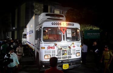 Trucks carrying first consignment of COVISHIELD, a coronavirus disease vaccine developed by AstraZeneca and Oxford University, leave from Serum Bio-Pharma Park of Serum Institute of India, for its distribution, in Pune, India, on January 12, 2021. (Reuters)