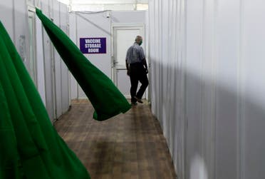 A health worker walks past a storage room during a trial run of COVID-19 vaccine delivery system, as India's prepare to kick off the coronavirus vaccination drive on January 16, 2021, in Mumbai, India. (AP)
