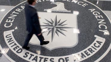 A man crosses the Central Intelligence Agency (CIA) seal in the lobby of CIA Headquarters in Langley, Virginia. (AFP)