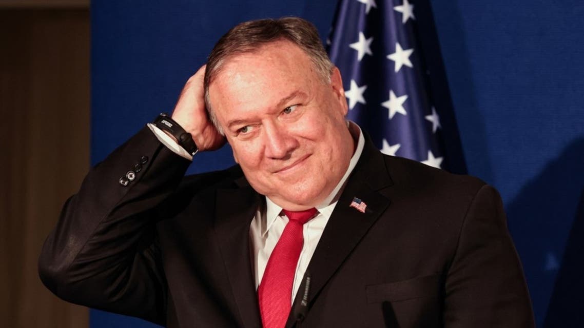 US Secretary of State Mike Pompeo pats his head during a press conference with the Israeli Prime Minister and Bahrain's Foreign Minister after their trilateral meeting in Jerusalem on November 18, 2020. (AFP)