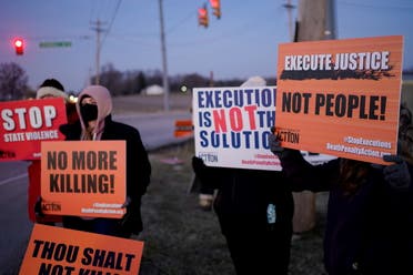 Activists in opposition to the death penalty gather to protest the execution of Lisa Montgomery. (Reuters)