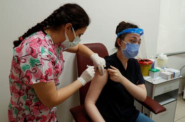 Doctor Ayse Kosereisoglu receives a shot of the Sinovac's CoronaVac COVID-19 vaccine at the Sancaktepe Sehit Dr. Ilhan Varank Training and Research Hospital, in Istanbul, Turkey, on January 14, 2021. (Reuters)