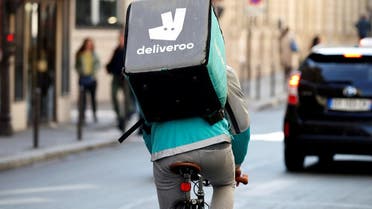 A cyclist rides a bicyle as he delivers food for Deliveroo, an example of the emergence of what is known as the 'gig economy', in Paris. (Reuters)