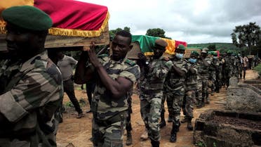 File photo of soldiers carrying flag-draped coffins of the 10 comrades, that the army said were killed in militant attacks in Gueri town, during an honor ceremony at the army headquarters in Kati, Mali, on September 6, 2020. (Reuters)
