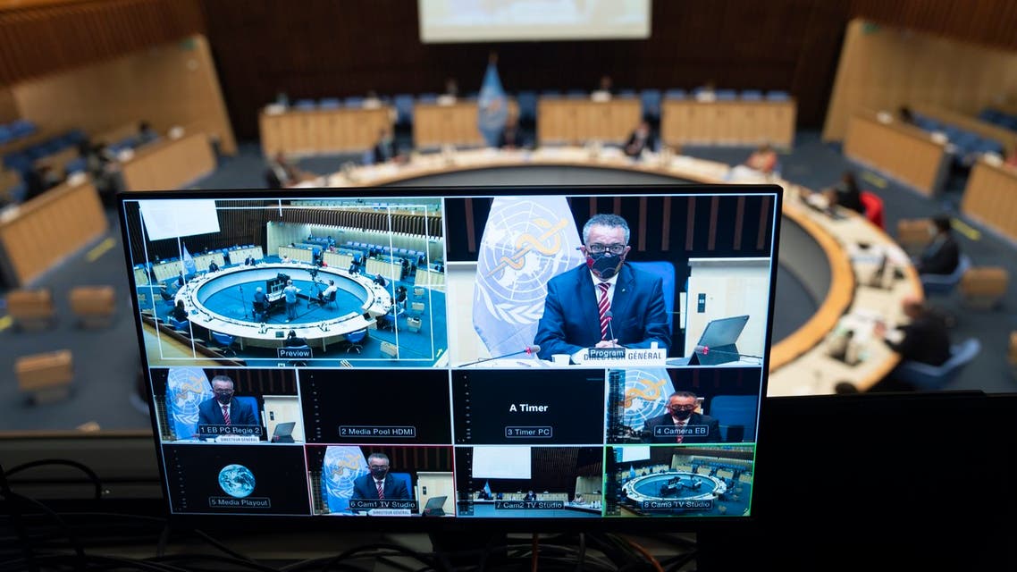 This handout picture taken and released by the World Health Organization on October 5, 2020 shows World Health Organization (WHO) Director-General Tedros Adhanom Ghebreyesus wearing a protective face mask delivering a speech on a TV screen during a WHO executive board special session on the Covid-19 response at the health agency's headquarters in Geneva. The WHO estimated Monday that 10 percent of the world has been infected by the new coronavirus -- way more than has been recorded -- as it mulled speeding up internal reforms.