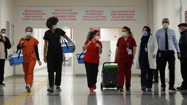 Health workers carry Sinovac's CoronaVac COVID-19 vaccine boxes at Sancaktepe Sehit Dr. Ilhan Varank Training and Research Hospital, in Istanbul, Turkey January 14, 2021. (Reuters)