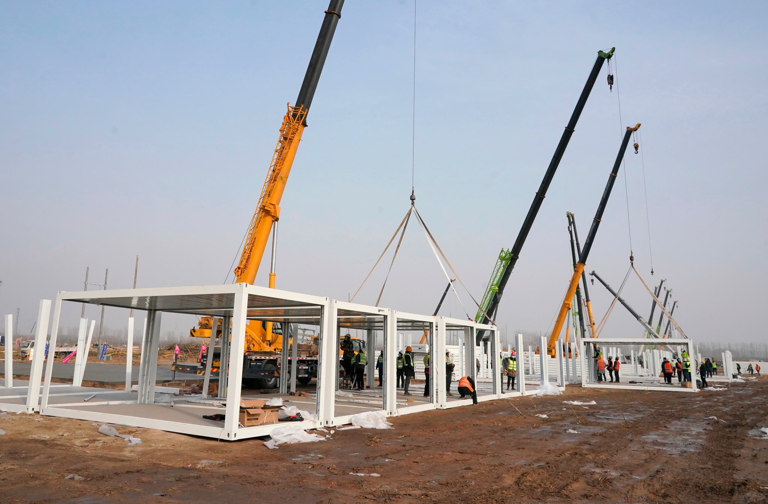 In this photo released by China's Xinhua News Agency, workers build a large centralized quarantine facility in Shijiazhuang in northern China's Hebei Province. (AP)
