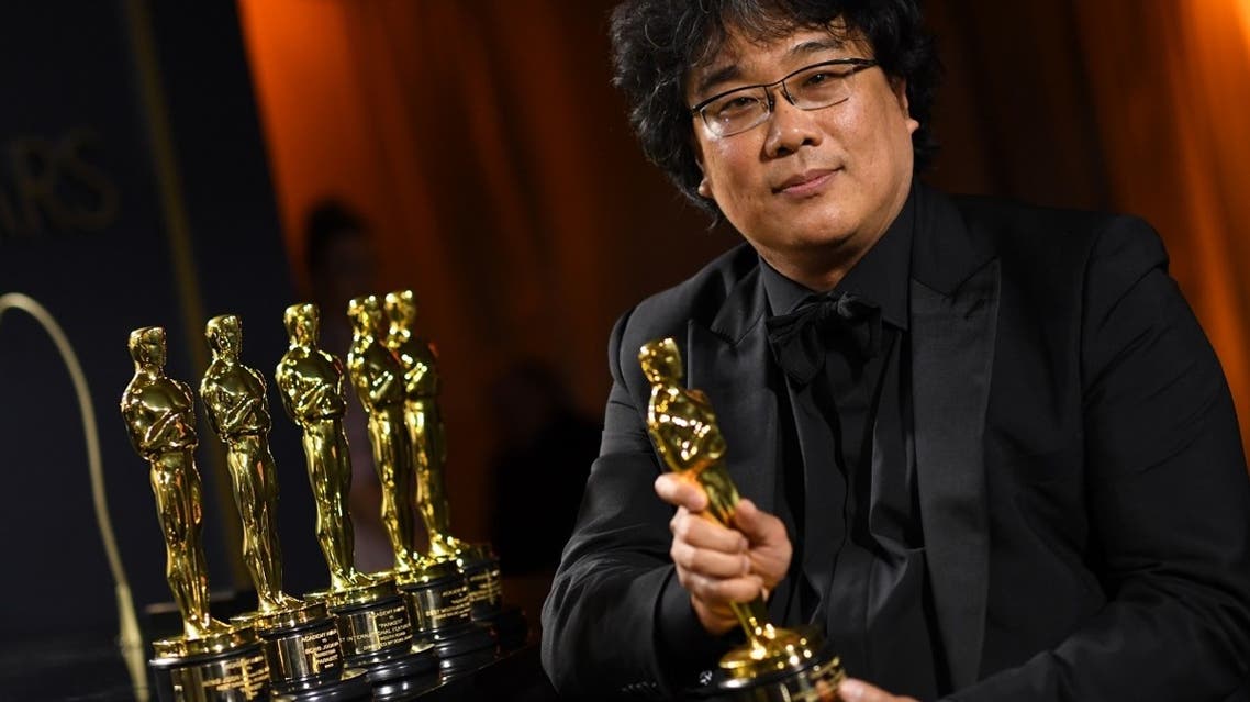 South Korean film director Bong Joon Ho poses with his engraved awards as he attends the 92nd Oscars Governors Ball at the Hollywood & Highland Center in Hollywood, California, on February 10, 2020. (AFP)