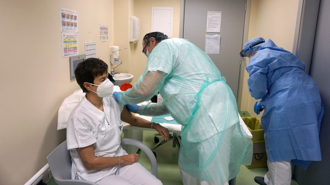 2021-01-A member of medical staff receives the Pfizer/BioNTech COVID-19 vaccine as Bergamo, the city at the centre of Italy's coronavirus tragedy, vaccinates thousands of health workers, on January 5, 2021. (Reuters)14T163849Z_1328805283_RC2S7L94BKX2_RTRMADP_3_HEALTH-CORONAVIRUS-ITALY-INVESTIGATION