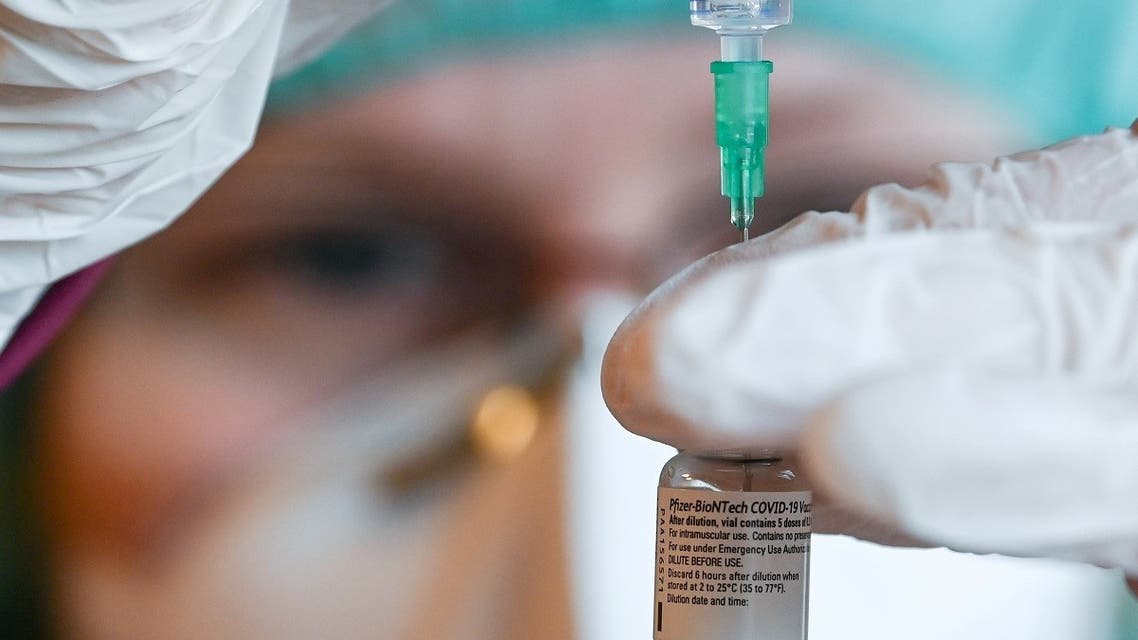 Pharmacist Susanne Wohlgemuth prepares Pfizer/BioNTech COVID-19 vaccinations at the Haus an der Linde nursing home in Lichtentanne, Saxony, Germany December 27, 2020, the day when the country starts its vaccination program. (Reuters)