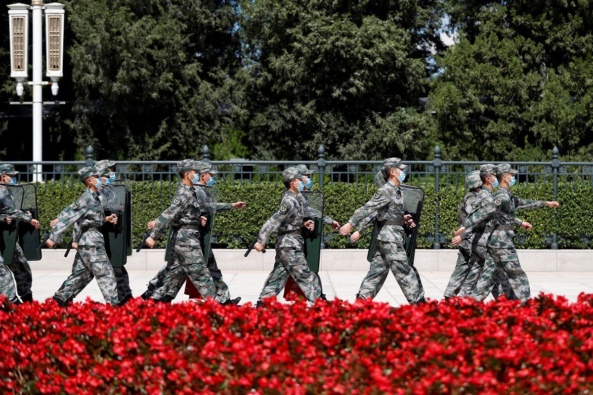 Soldiers of the People's Liberation Army (PLA) march outside the Great Hall of the People in Beijing. (Reuters)