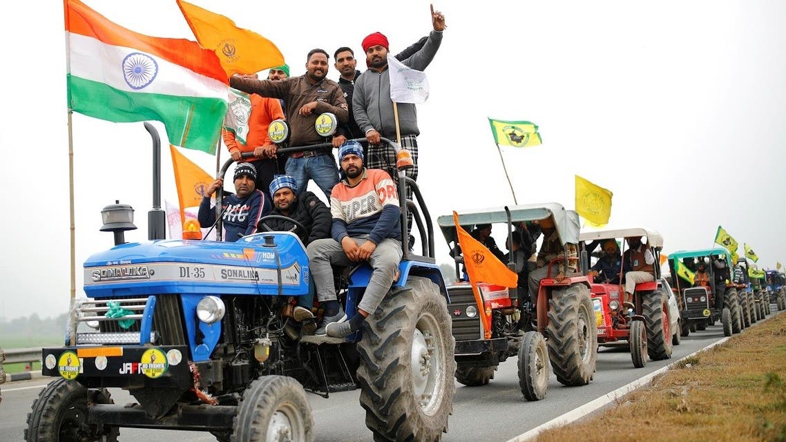 Farmers participate in a tractor rally to protest against the newly passed farm bills, on a highway on the outskirts of New Delhi, India, on January 7, 2021. (Reuters)