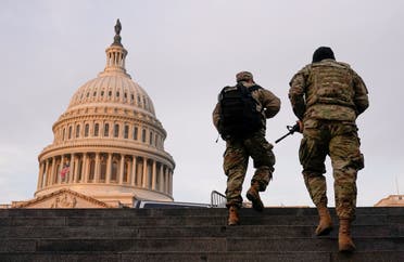 National Guard members walk at the Capitol, in Washington, US, January 15, 2021. (Reuters)