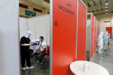A Bahraini man waits to get a dose of a coronavirus disease (COVID-19) vaccine, at Bahrain International Exhibition & Convention Centre (BIECC), in Manama. (Reuters)