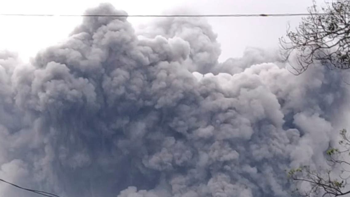 In this photo released by Indonesia's National Disaster Mitigation Agency (BNPB) Mount Semeru spews volcanic material during an eruption in Lumajang, East Java, Indonesia, Saturday, Jan. 16, 2021. The highest volcano on Indonesia's most densely populated island of Java, spewed hot clouds as far away as 4.5 kilometers (nearly 3 miles) on Saturday. (National Disaster Mitigation Agency via AP)
