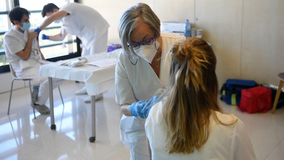 Medical workers receive injections of the Moderna Covid-19 vaccine at the Hospital Sant Joan de Deu in Barcelona on January 16, 2021. With daily coronavirus infections hitting a record high after the Christmas holidays, several Spanish regions moved Friday to further tighten restrictions on social life.