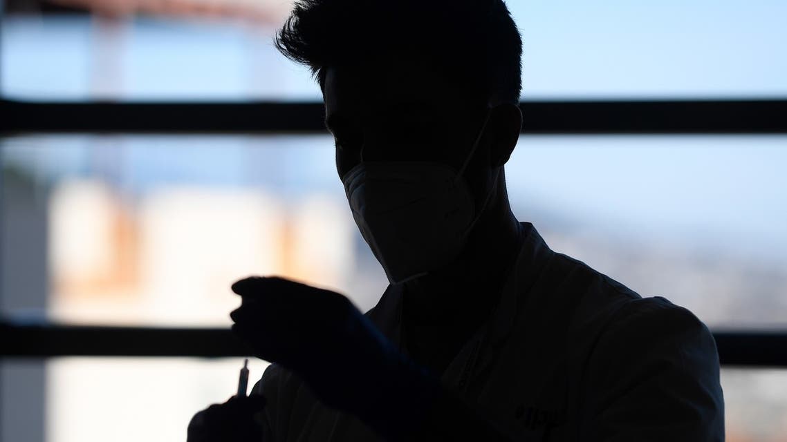 A medical worker prepares a Moderna Covid-19 vaccine at the Hospital Sant Joan de Deu in Barcelona on January 16, 2021. With daily coronavirus infections hitting a record high after the Christmas holidays, several Spanish regions moved Friday to further tighten restrictions on social life.