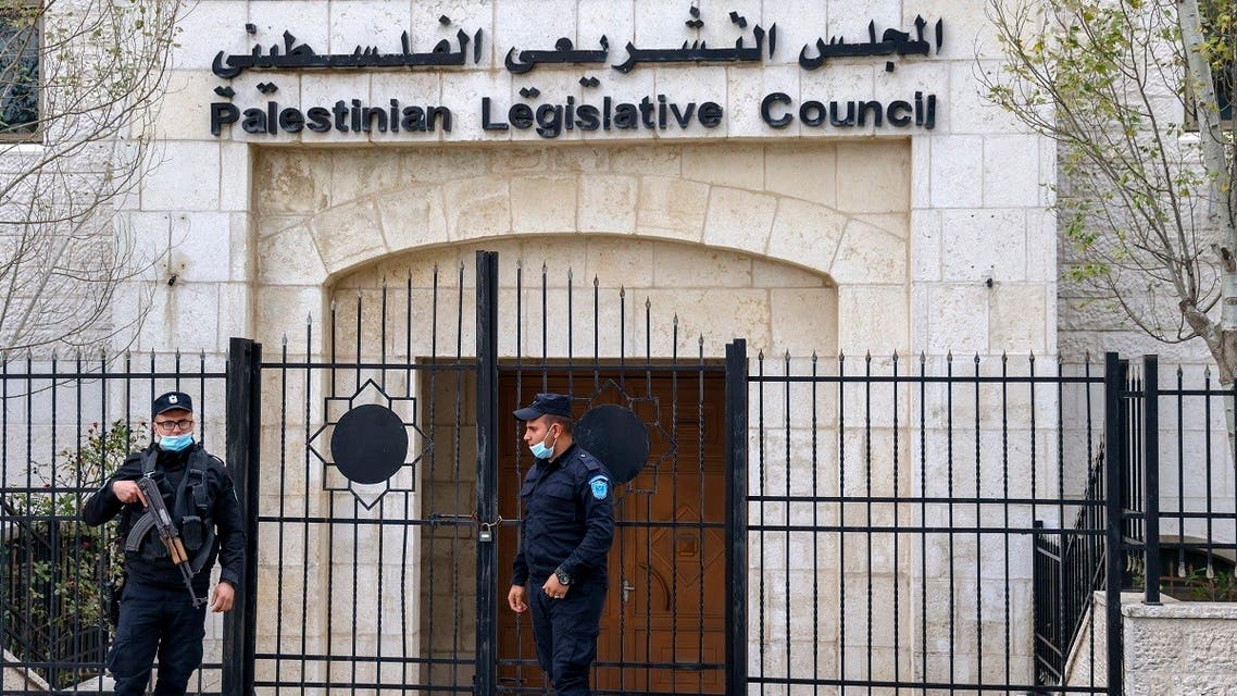 Members of the Palestinian security forces stand guard outside the Legislative Council building in the occupied-West Bank town of Ramallah, on January 16, 202. (Ahmad Gharabli/AFP)