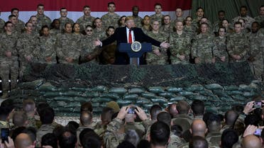 (FILES) In this file photo taken on November 28, 2019, US President Donald Trump speaks to the troops during a surprise Thanksgiving visit at Bagram Air Fieldin Afghanistan. The US military has cut troop levels in Afghanistan and Iraq to 2,500 each, their lowest levels in the nearly two decades since the wars began, the Pentagon announced on January 15, 2021.