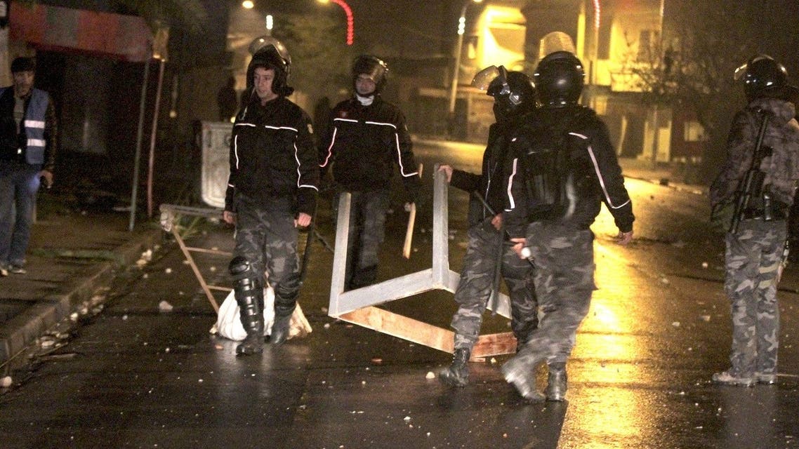 Security forces gather during clashes with demonstrators, at the scene of a protest in the Tunisian city of Siliana, the capital of the governorate of the same name, about 130 kms southwest of the capital Tunis, on January 16, 2021. (Feouzi Dridi/AFP)