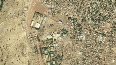 This satellite photo provided on Sunday January 17, 2021 by Planet Labs, Inc. shows the destruction of UN World Food Program warehouses at the Shimelba refugee camp in Ethiopia's Tigray region on January 5, 2021, bottom center left, and before it was destroyed on December 10, 2020, top. (2021 Planet Labs, Inc via AP)