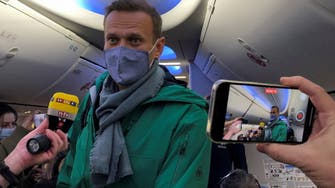 Kremlin critic Navalny lands in Moscow where he faces arrest