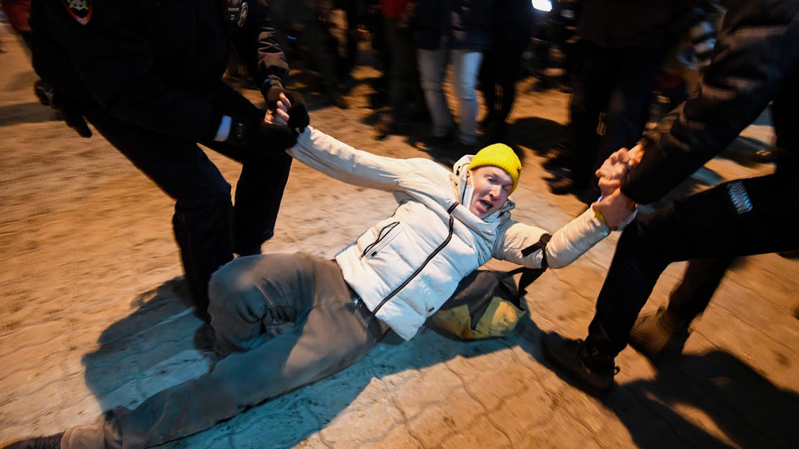 Police officers detain a man at Moscow's Vnukovo airport where Russian opposition leader Alexei Navalny is expected to arrive on January 17, 2021. Chief Kremlin critic Alexei Navalny returns to Russia from Germany on January 17, facing imminent arrest after authorities warned they would detain him. The 44-year-old opposition leader is flying back to Moscow after spending several months in Germany recovering from a poisoning attack that he said was carried out on the orders of President Vladimir Putin. NATALIA KOLESNIKOVA / AFP