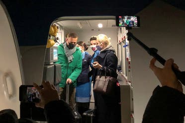 Russian opposition leader Alexei Navalny and his wife Yulia Navalnaya walk out of a plane after arriving at Sheremetyevo airport in Moscow, Russia January 17, 2021. (Reuters/Polina Ivanova)