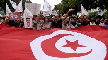 Tunisians take part in a demonstration on September 16, 2017 in Tunis to protest the parliament's passing of an amnesty law for officials accused of corruption under toppled President Ben Ali. (Fethi Belaid/AFP)