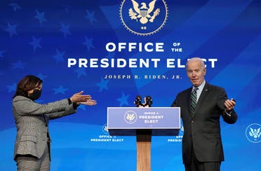 U.S. Vice President-elect Kamala Harris gestures toward President-elect Joe Biden after he introduced key members of his White House science team at his transition headquarters in Wilmington, Delaware, US. (Reuters)