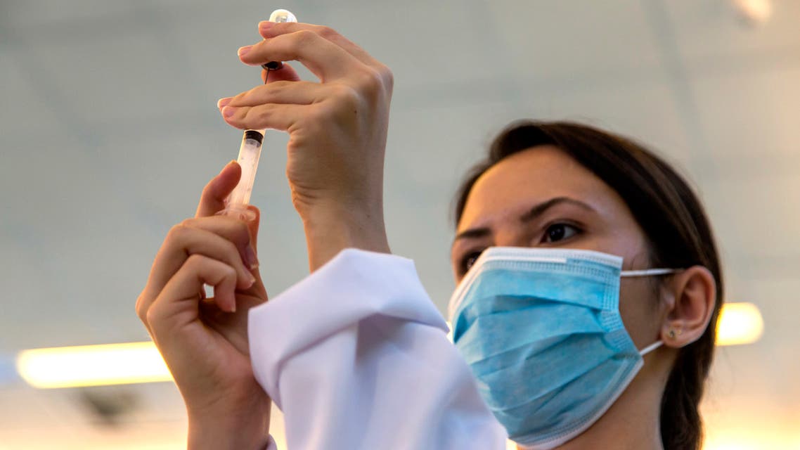 A nurse prepares a shot of the COVID-19 vaccine produced by China’s Sinovac Biotech Ltd, at the Hospital das Clinicas in Sao Paulo, Brazil, Sunday, Jan. 17, 2021. (AP)