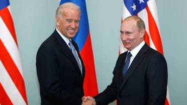 US president-elect Joe Biden, left, shakes hands with Russian Prime Minister Vladimir Putin in Moscow, Russia. (File photo:AP)
