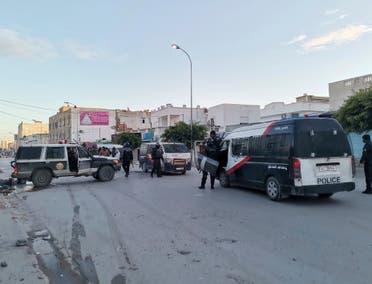 Police officers face demonstrators during clashes in Ben Arous, Tunisia, Sunday, Jan. 17, 2021. (AP)