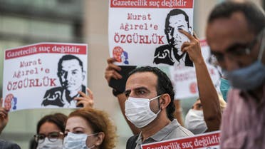 Demonstrators hold posters of jailed journalists as they stage a protest in front of a courthouse in Istanbul on September 9, 2020, before a trial of jailed journalists. Eight people including seven journalists have gone on trial in Turkey charged with revealing state secrets in a case condemned by rights groups.