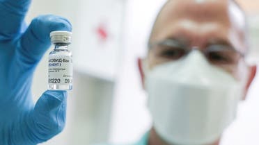 A file photo shows a medical worker holds a vial of the Russian Sputnik V coronavirus vaccine in Belgrade, Serbia, January 6, 2021. (Reuters/Fedja Grulovic)