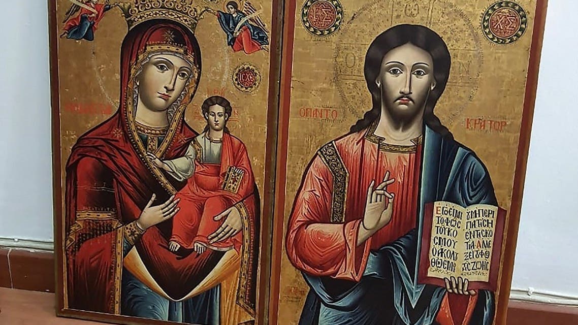 A picture taken on January 18, 2021 shows two 18th-century religious icons depicting Jesus and Mary that were stolen in Greece and were seized by Lebanese authorities during an auction in the capital Beirut. (AFP)