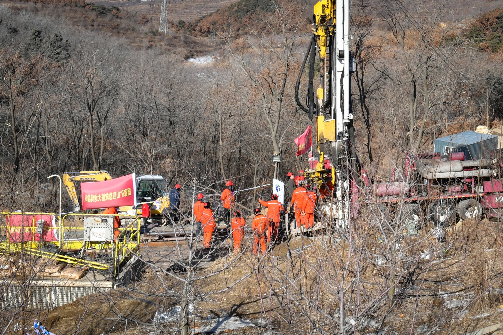 This photo taken on January 13, 2021 shows rescuers working at the site of gold mine explosion where 22 miners were trapped.