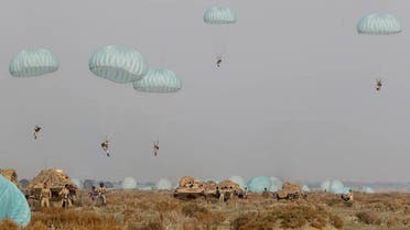 In this photo released on Tuesday, Jan. 19, 2021, by the Iranian Army, shows paratroopers parachuting during a military drill. (AP)